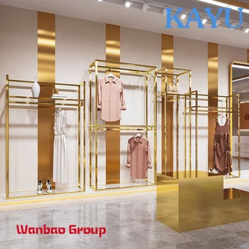 Özel Paslanmaz Çelik Butik Altın kıyafet rafları Konfeksiyon Metal Raf Kadın Mağaza Elbise Teşhir Standları Giyim Mağazaları için